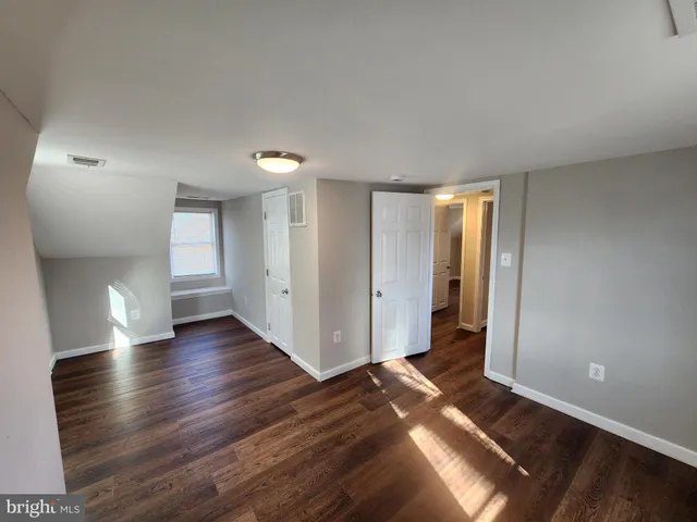a view of livingroom with hardwood floor and hallway
