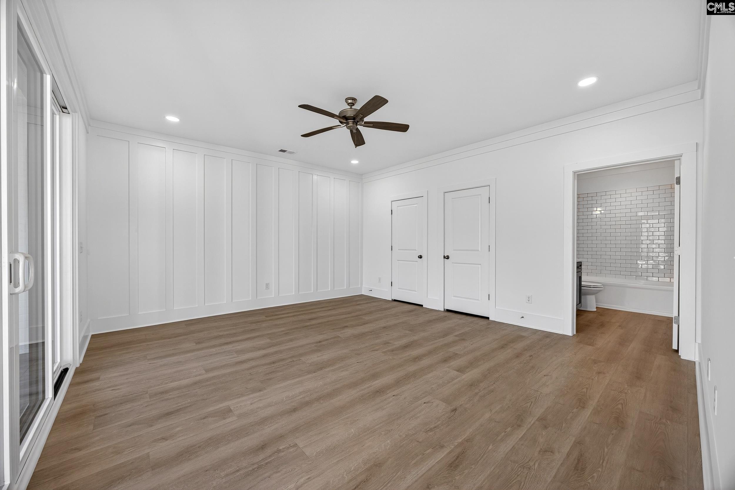 1318 Long Grove Way Lexington, SC 29072 - Photo 42 of 90 wooden floor in an empty room with a window