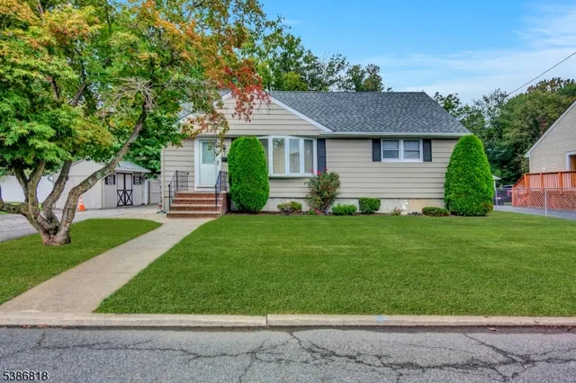 front view of a house with a yard