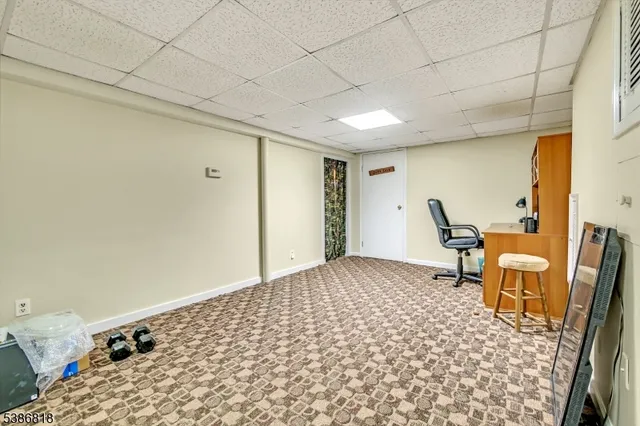a view of a bedroom with furniture and staircase