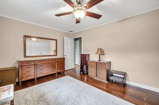 a bedroom with furniture and a dresser