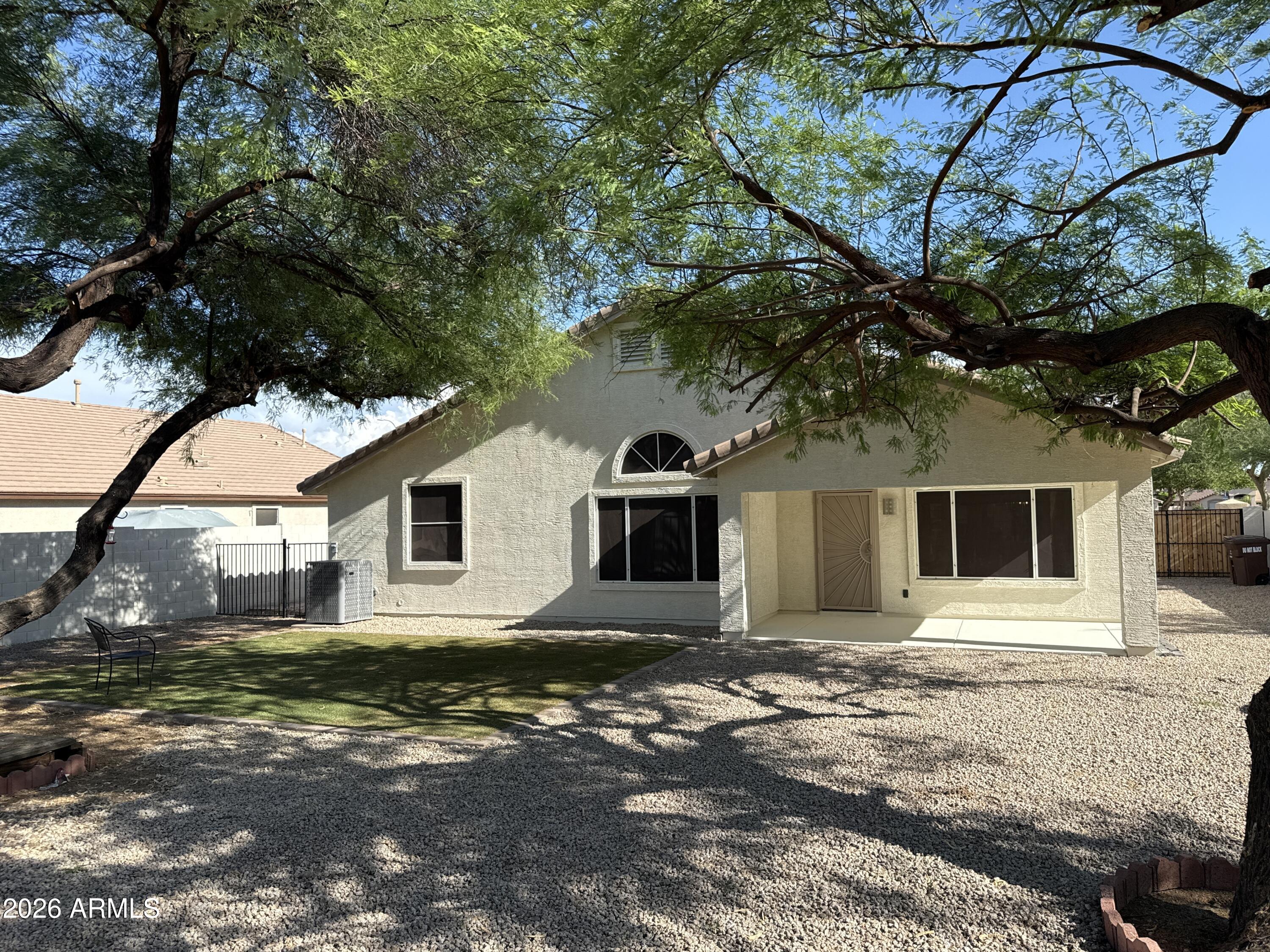 9630 West Reno View Drive Peoria, AZ 85345 - Photo 20 of 21 a front view of a house with yard