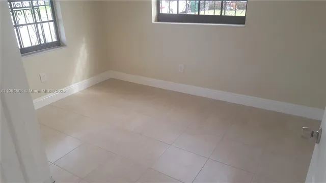 an empty room with windows