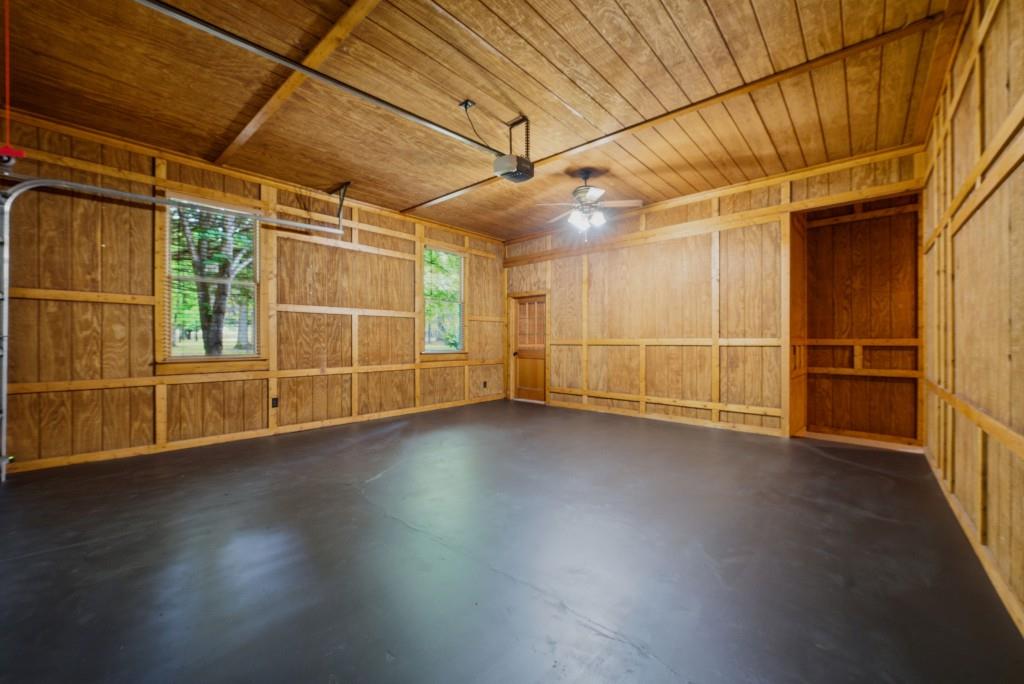542 Knox Chapel Road Social Circle, GA 30025 - Photo 23 of 52 an empty room with wooden floor and windows