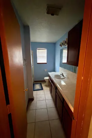 a kitchen with a sink and a stove top oven