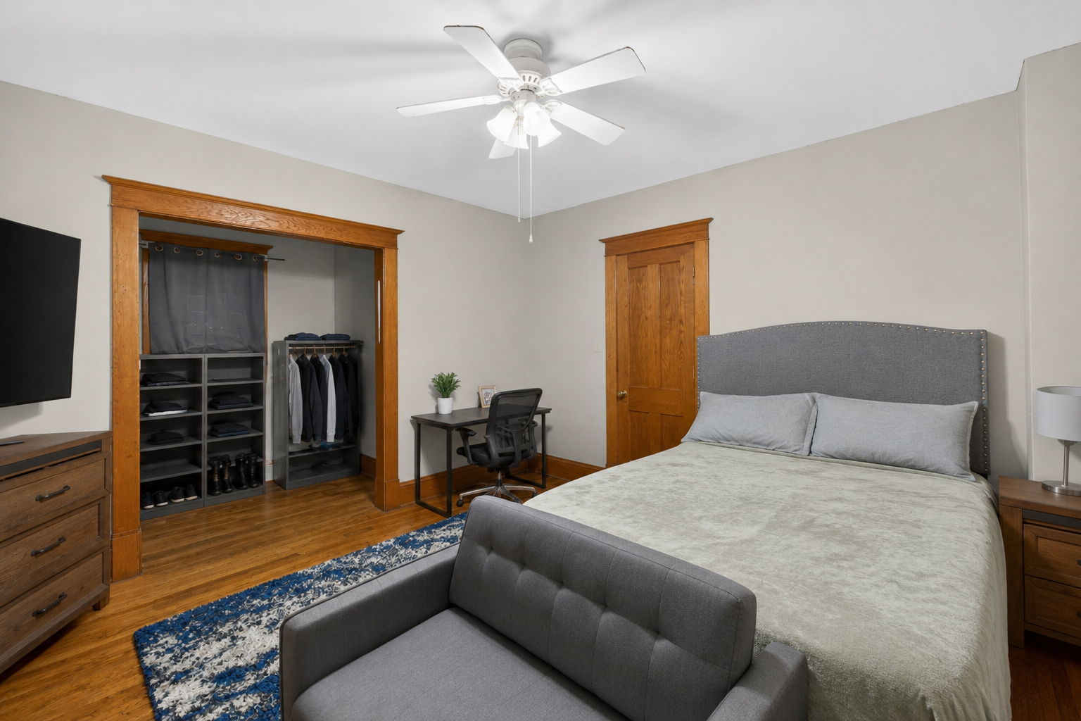 226 West Locust Street DeKalb, IL 60115 - Photo 12 of 40 a bedroom with a bed and a television