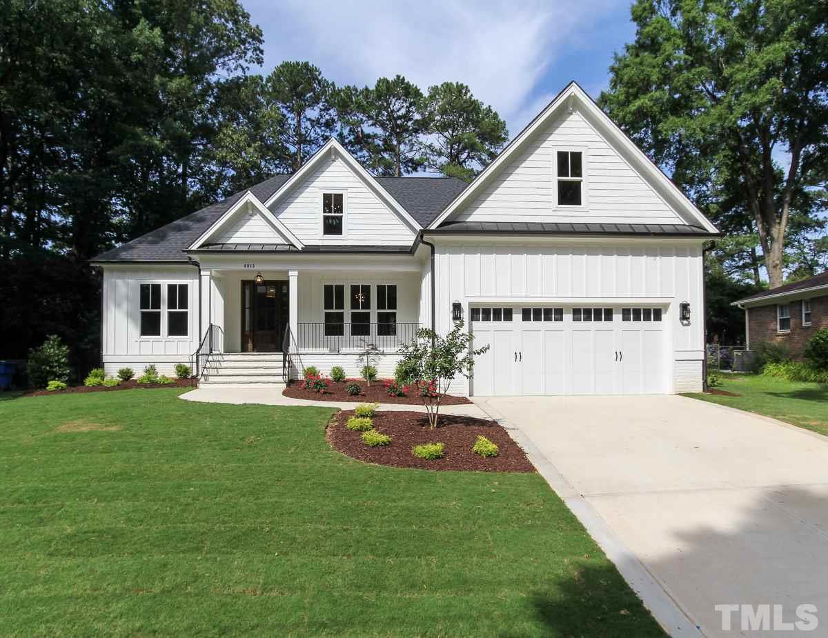 4913 Latimer Road Raleigh, NC 27609 - Photo 1 of 25 a front view of a house with a yard