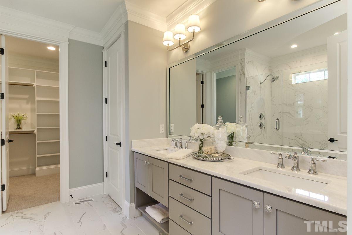 4913 Latimer Road Raleigh, NC 27609 - Photo 14 of 25 a bathroom with double sink and a mirror