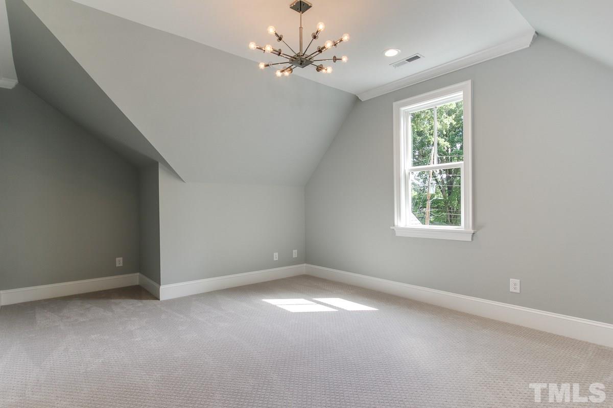4913 Latimer Road Raleigh, NC 27609 - Photo 23 of 25 wooden floor in an empty room with a window