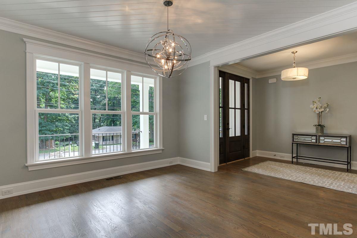 4913 Latimer Road Raleigh, NC 27609 - Photo 5 of 25 a view of a room with window wooden floor and windows