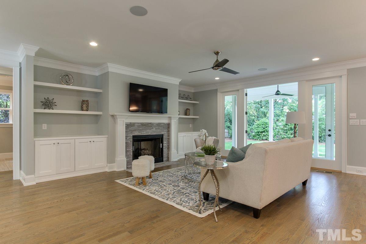 4913 Latimer Road Raleigh, NC 27609 - Photo 6 of 25 a living room with furniture fireplace and flat screen tv