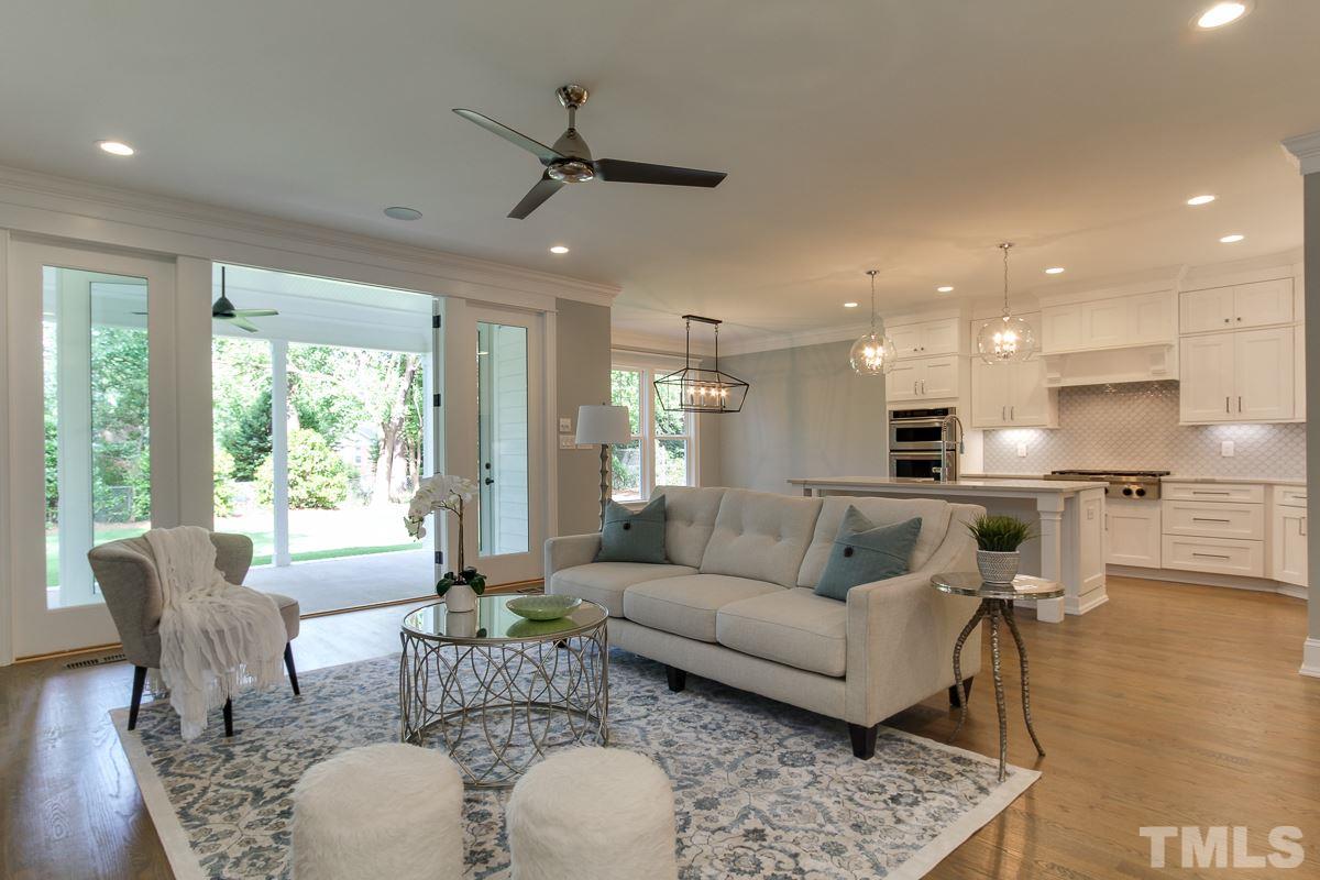 4913 Latimer Road Raleigh, NC 27609 - Photo 7 of 25 a living room with furniture and a large window