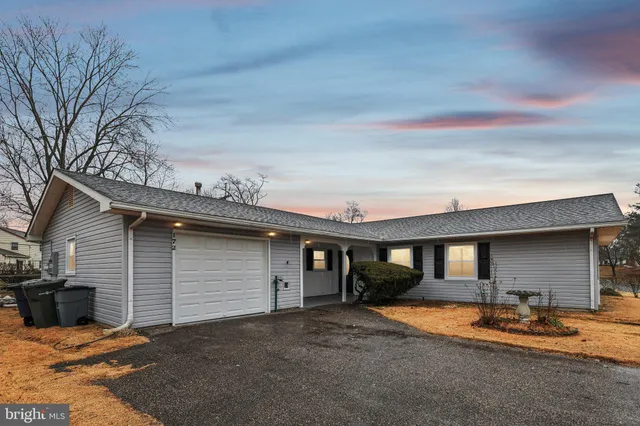 a front view of a house with a patio