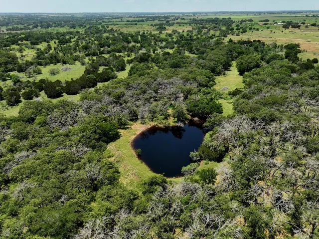 a view of a lake with sitting area