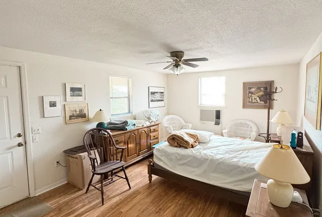 a room with a chair and a window