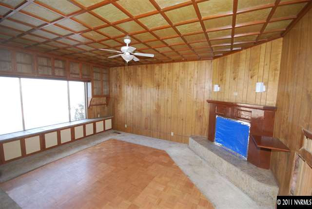 1095 Hot Springs Road Reno, NV 89521 - Photo 8 of 13 a view of an empty room with a window