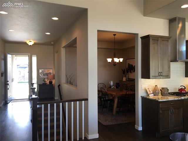 2056 Ripple Ridge Road Colorado Springs, CO 80921 - Photo 5 of 10 formal dining room to front door as viewed from great room