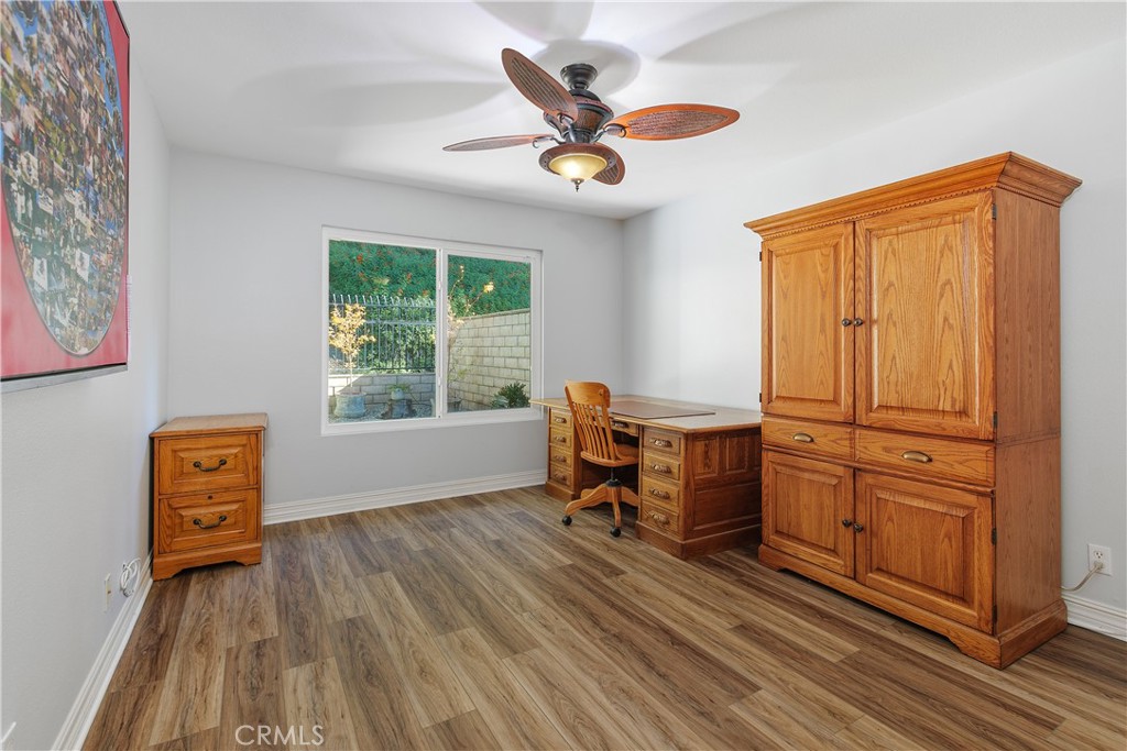 547 Vía Zapata Riverside, CA 92507 - Photo 22 of 36 Bedroom #2 has new laminate flooring and faces the back of the home.
