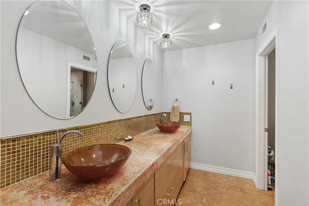 547 Vía Zapata Riverside, CA 92507 - Photo 26 of 36 The bathroom features custom quartz sinks and plenty of storage.