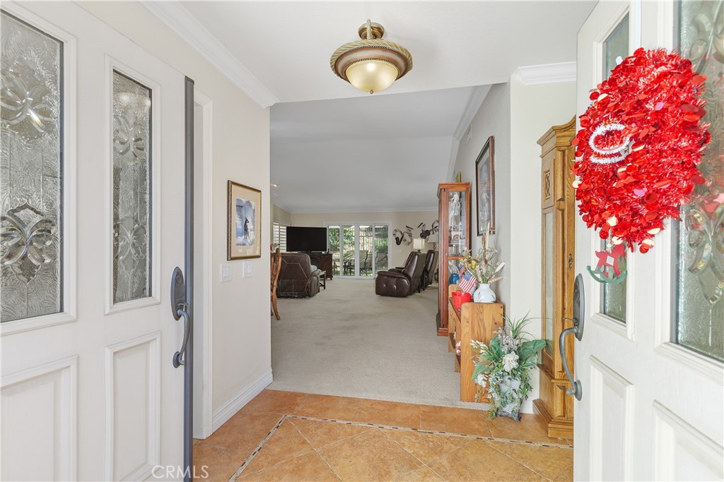547 Vía Zapata Riverside, CA 92507 - Photo 4 of 36 Entering through the leaded glass double doors, you come into the home's entry foyer.