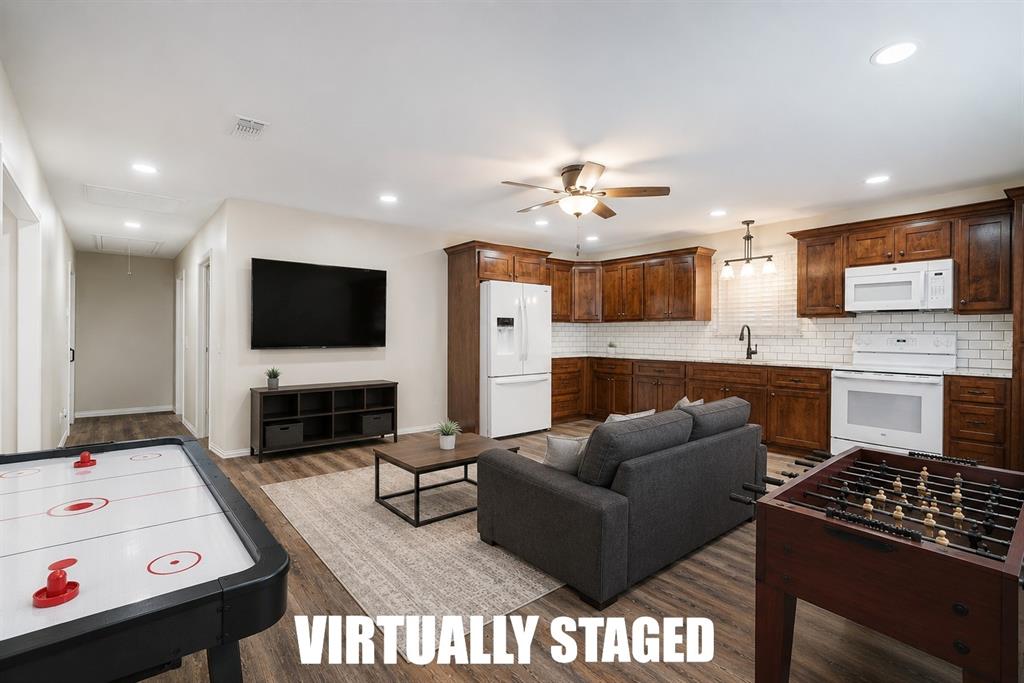 201 Farm To Market 906 Powderly, TX 75473 - Photo 34 of 37 a living room with furniture and a flat screen tv