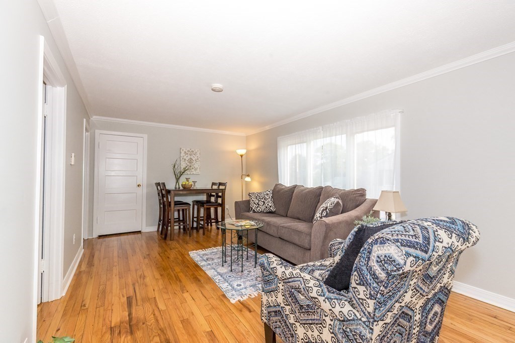 3 Taylor Road Billerica, MA 01821 - Photo 8 of 20 a living room with furniture and wooden floor