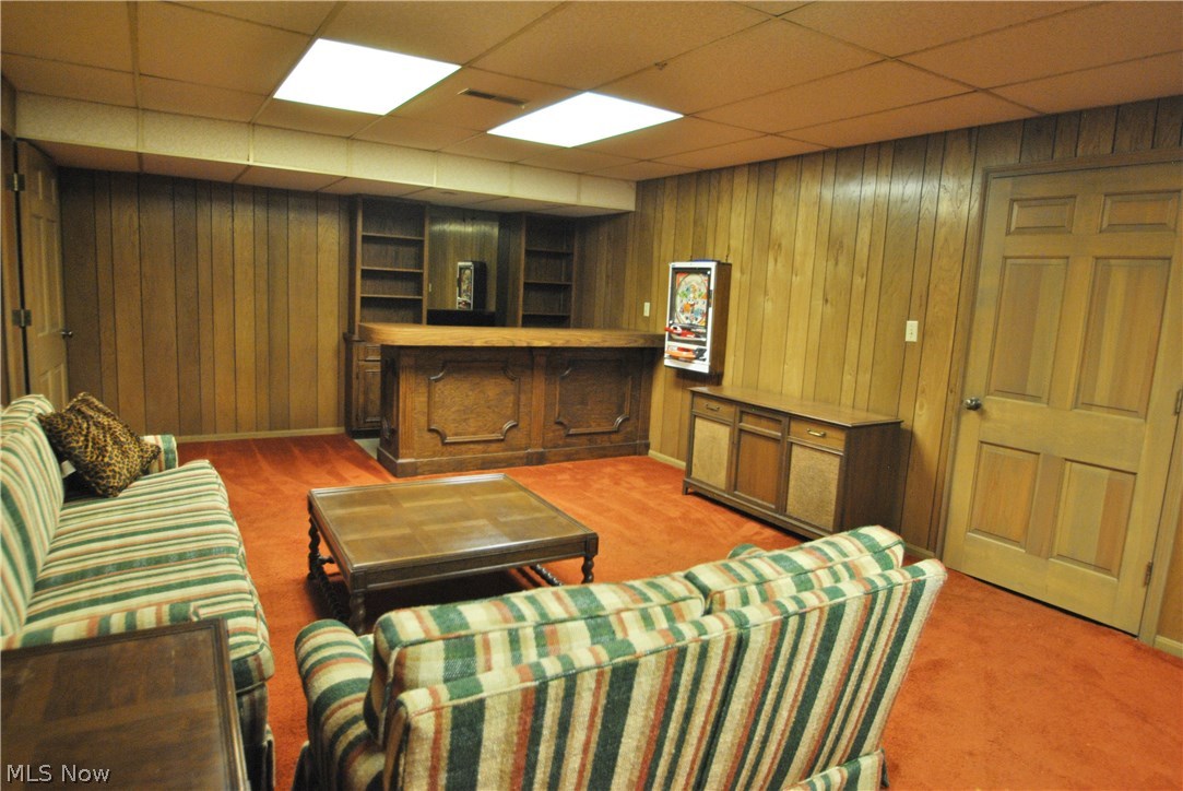 2250 Lancaster Road Akron, OH 44313 - Photo 27 of 35 Recreation room has overhead lighting, paneled walls and wet bar area.
