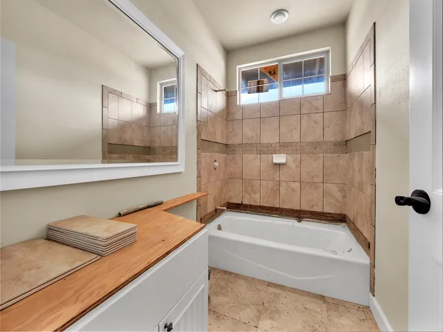 an aerial view of a house with a swimming pool