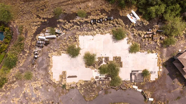 an aerial view of residential houses with outdoor space