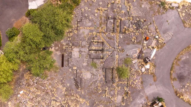 an aerial view of residential houses with outdoor space