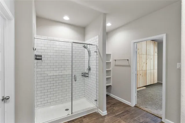 a view of an empty room with closet and a chandelier fan
