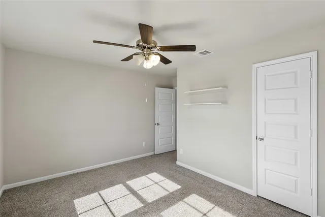 a bathroom with a bathtub shower sink mirror vanity and toilet