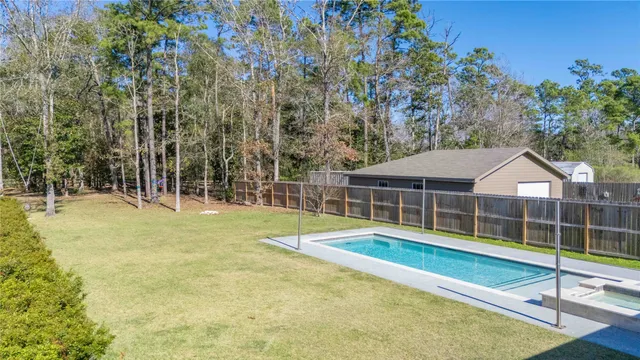 a view of a backyard with a trampoline