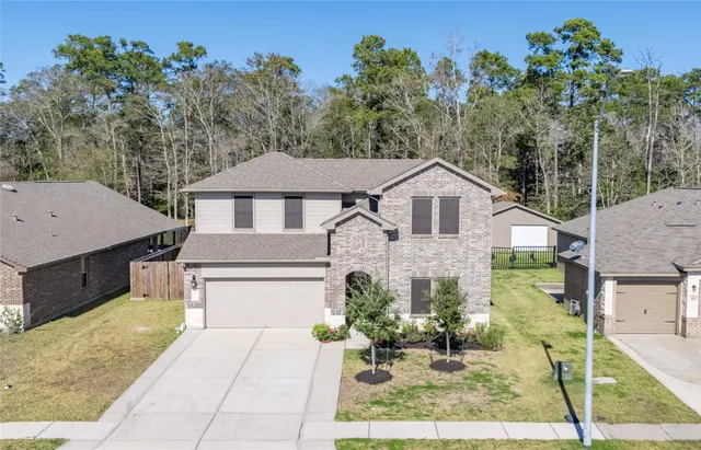 a front view of a house with a garage
