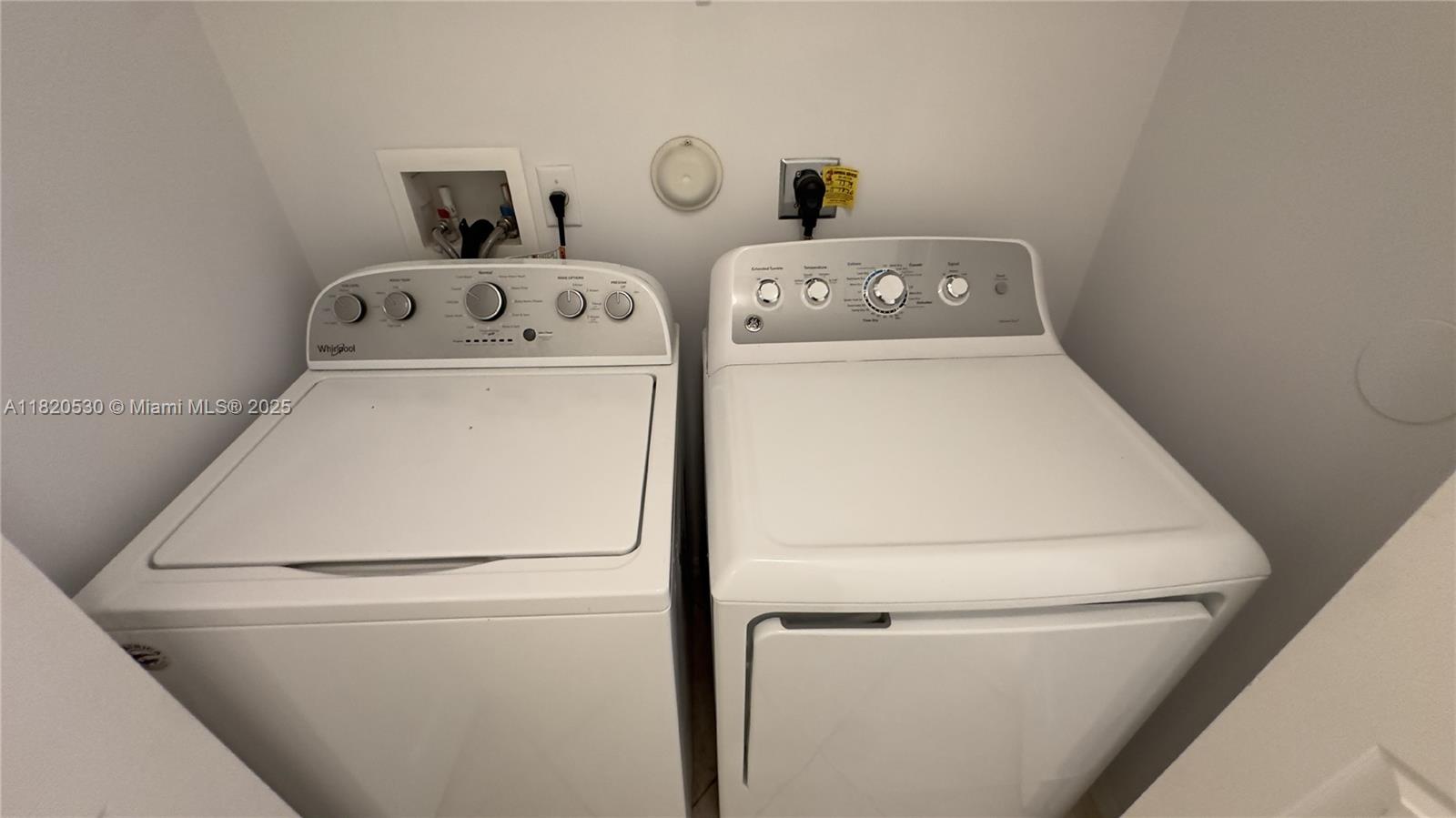 1587 Frederick Small Road Jupiter, FL 33458 - Photo 12 of 30 a utility room with dryer and washer