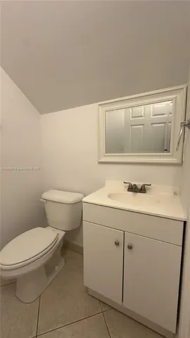 a bathroom with a sink a toilet and vanity