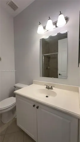 a bathroom with a sink a toilet and bathtub
