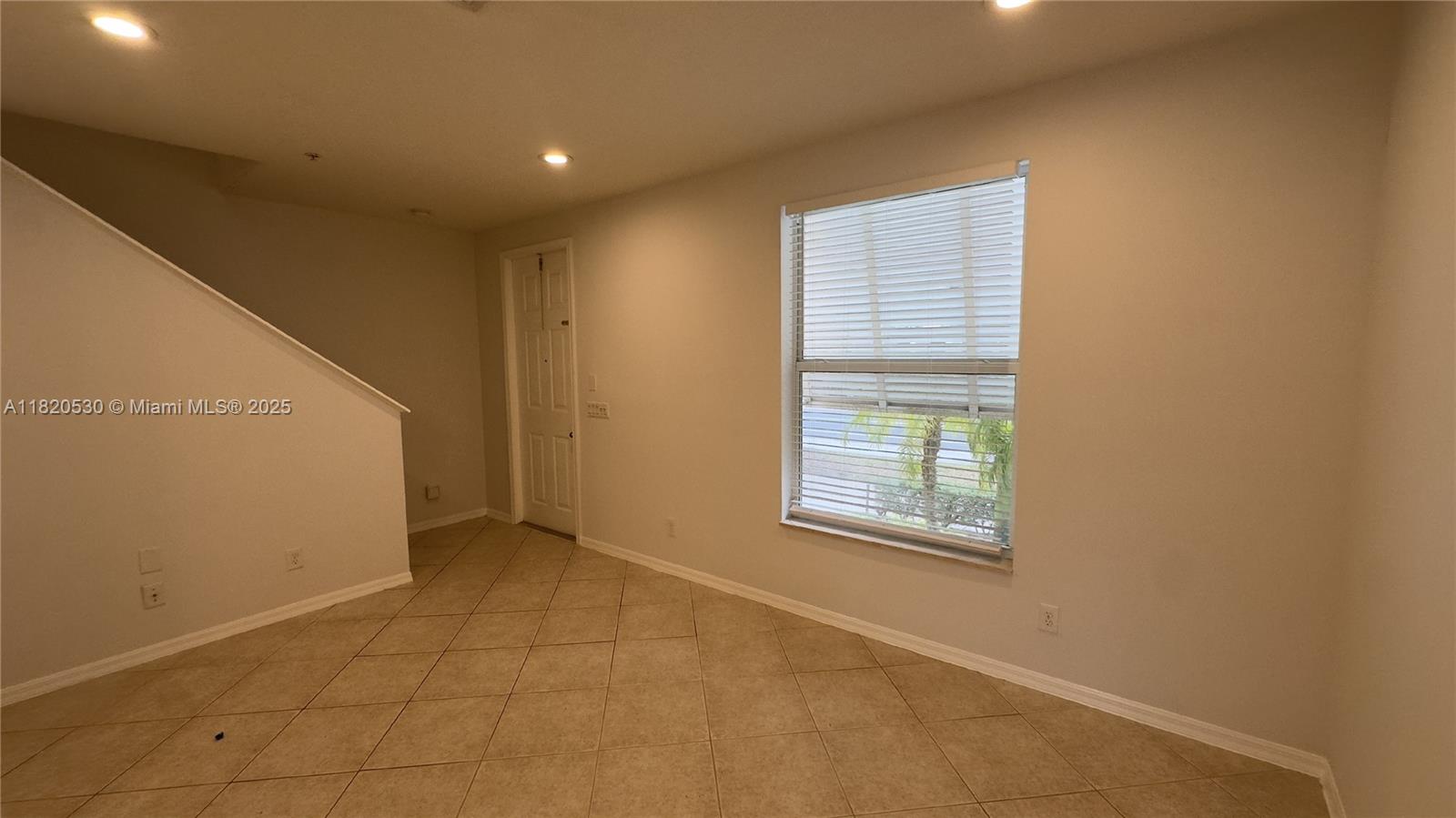 1587 Frederick Small Road Jupiter, FL 33458 - Photo 4 of 30 a view of an empty room with a window