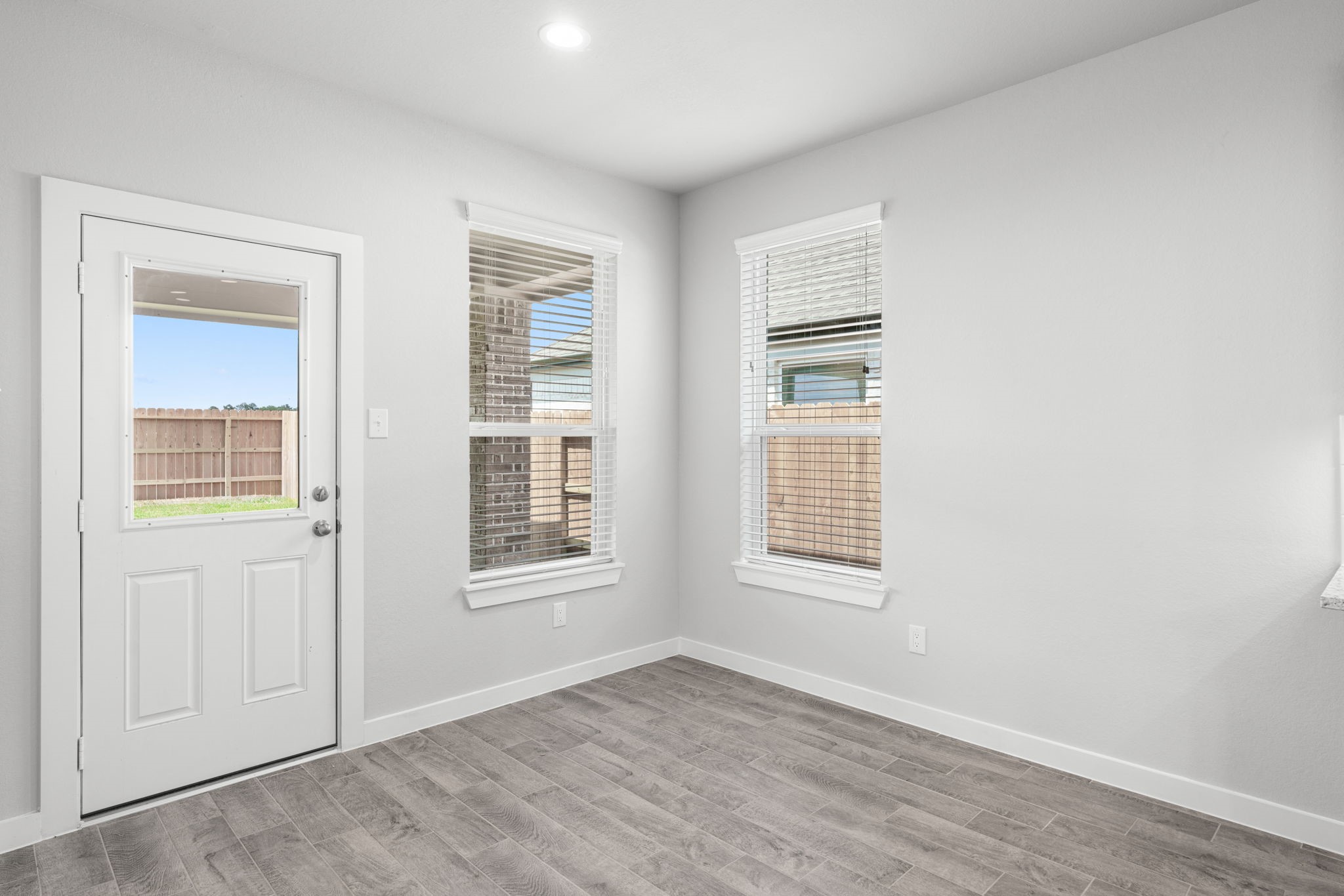 15123 Statice Trail Houston, TX 77044 - Photo 12 of 24 an empty room with windows