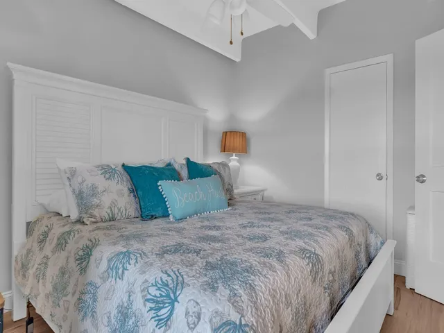 a large bed sitting in a bedroom next to a bedroom