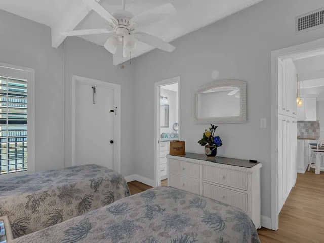 a bedroom with a bed and a dresser