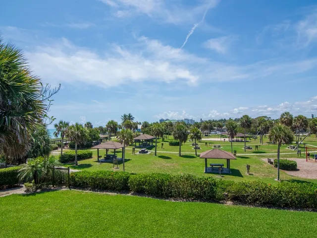 a view of a garden with houses