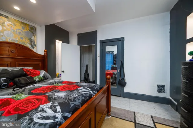 a bedroom with bed and a tv