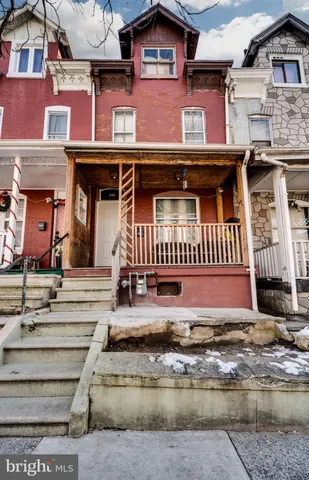 a view of a brick building with many windows