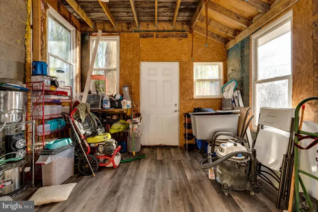 a view of a storage room with water heater and racks
