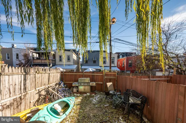 a view of a chairs and table in patio
