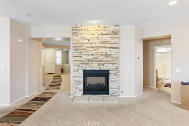 a large kitchen with stainless steel appliances granite countertop a refrigerator stove and sink