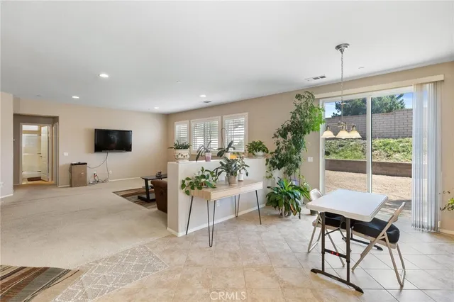 a kitchen with granite countertop a stove sink and cabinets