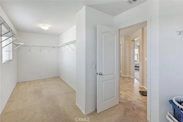 a white toilet sitting next to a window