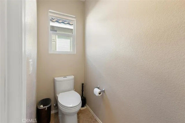 a view of a kitchen with an entryway and white walls